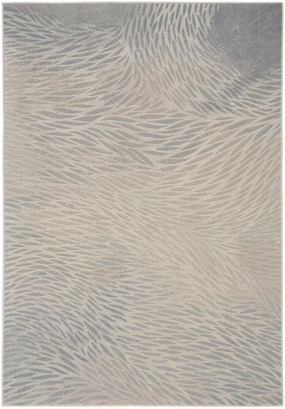 Beige and blue-gray abstract patterned area rug with soft, featherlike waves and plush pile.