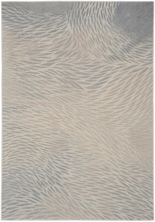 Beige and blue-gray abstract patterned area rug with soft, featherlike waves and plush pile.
