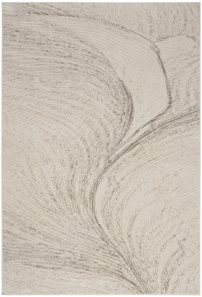 Beige rug with abstract swirl texture and cream and taupe marbling; modern pattern, 5' x 7'.