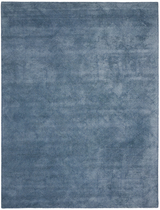 Blue textured rectangular area rug with subtle denim-toned patchwork; modern, cozy floor decor.