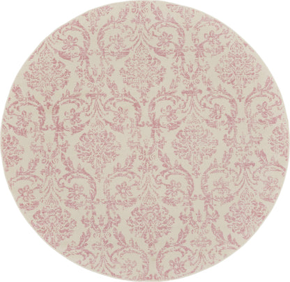 Round rug with cream background and pink damask pattern, ornate vintage floral design.
