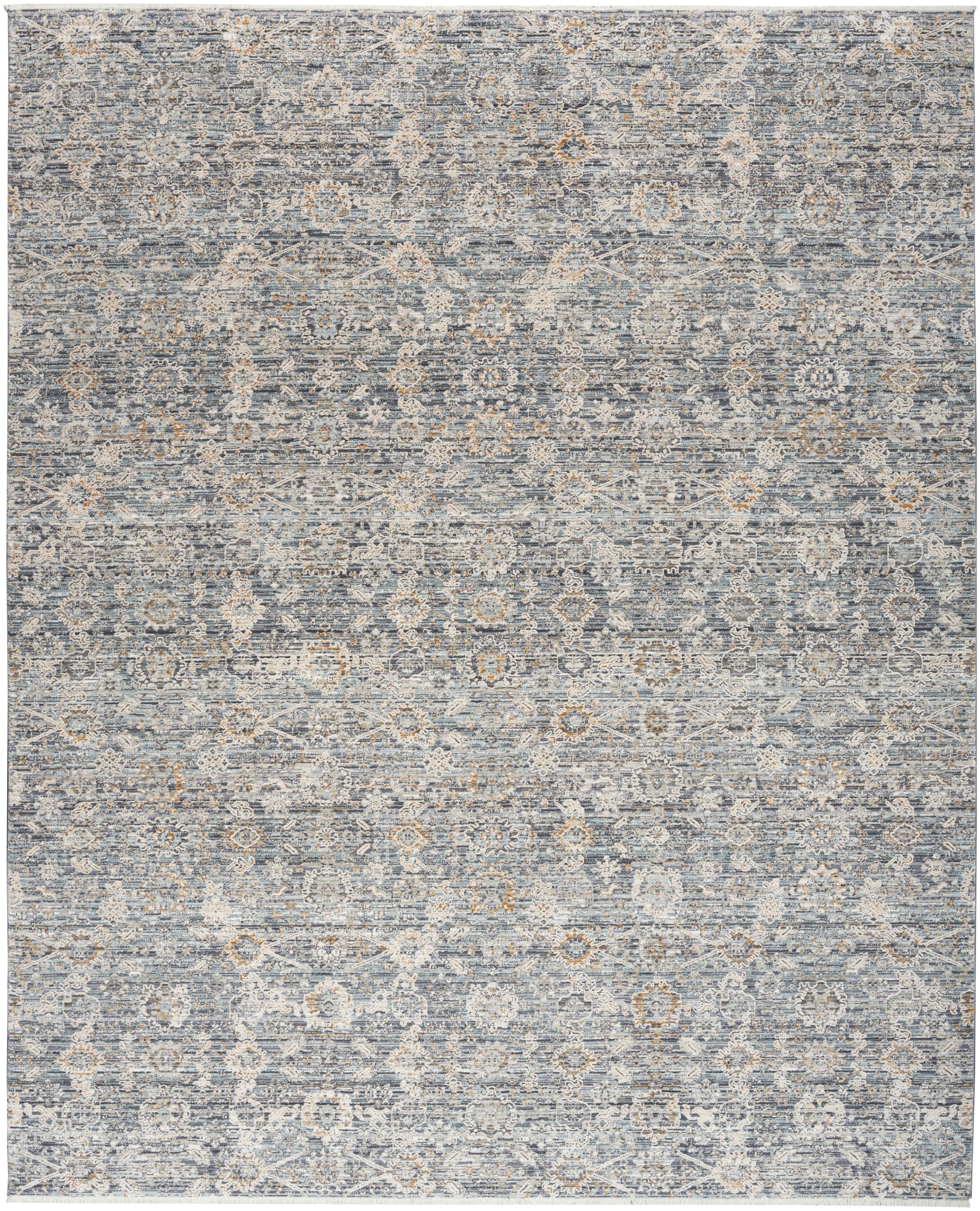 Rectangular blue-gray distressed patterned rug with ivory floral medallions; kilim-inspired, softly woven.