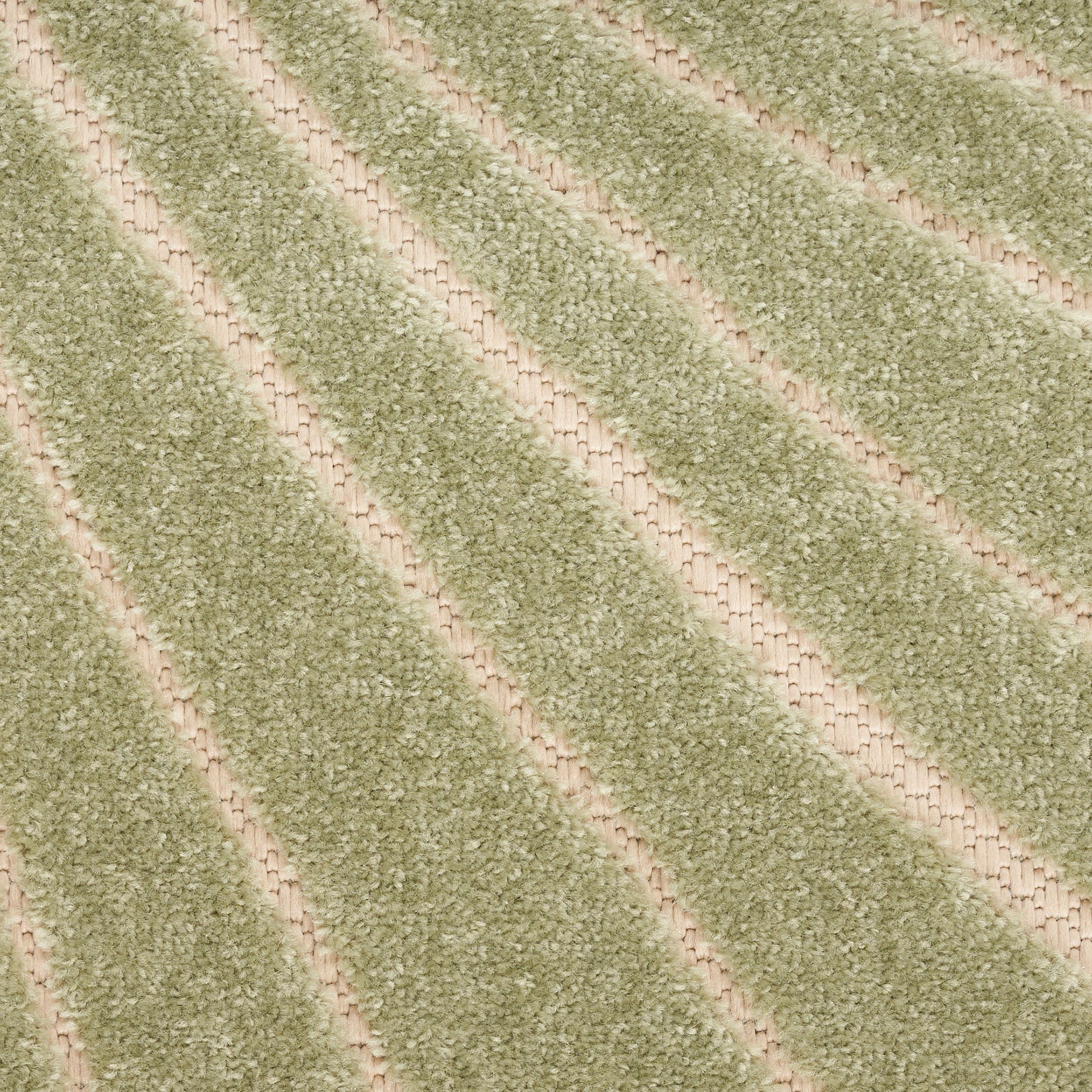 Green shag rug with diagonal beige stripes, plush pile, modern cozy living room decor.