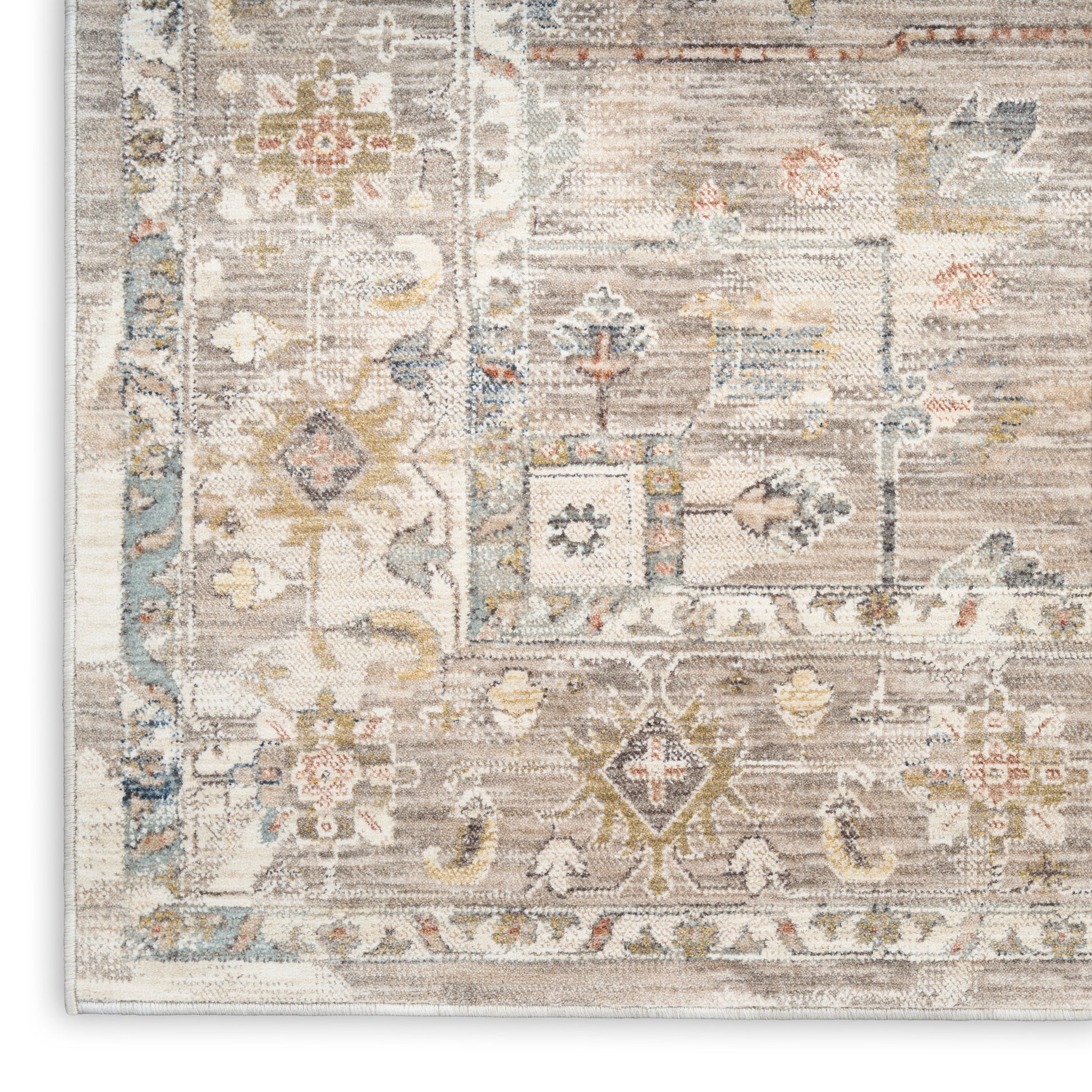 Distressed traditional Oriental rug in ivory, beige, pale blue and gray with floral motifs and a decorative border.