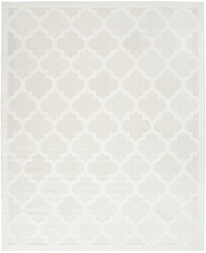 Rectangular neutral-toned flat-weave area rug with light gray quatrefoil lattice pattern.