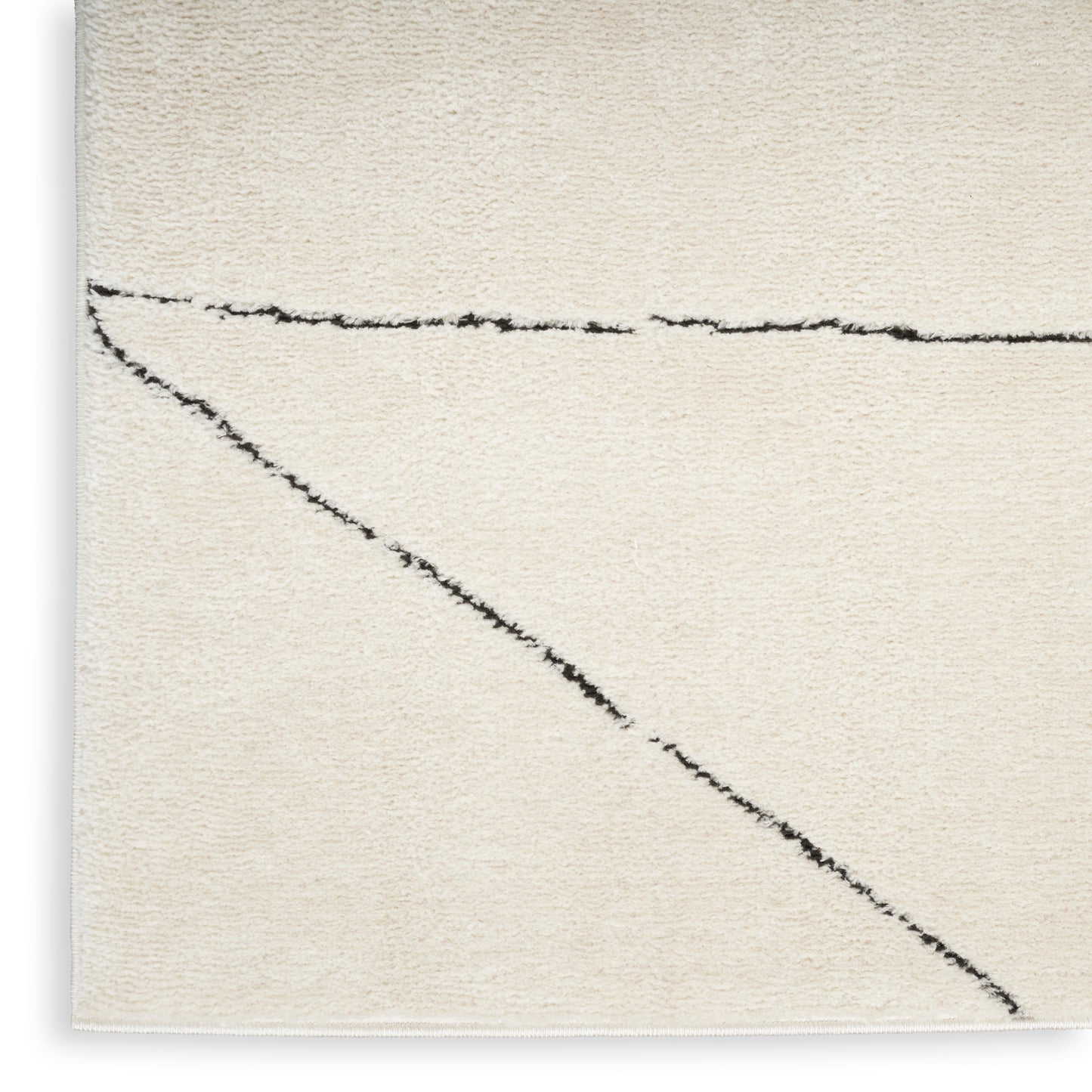 Cream textured rug with black abstract diagonal and horizontal lines; soft wool-like pile, modern minimalist area rug
