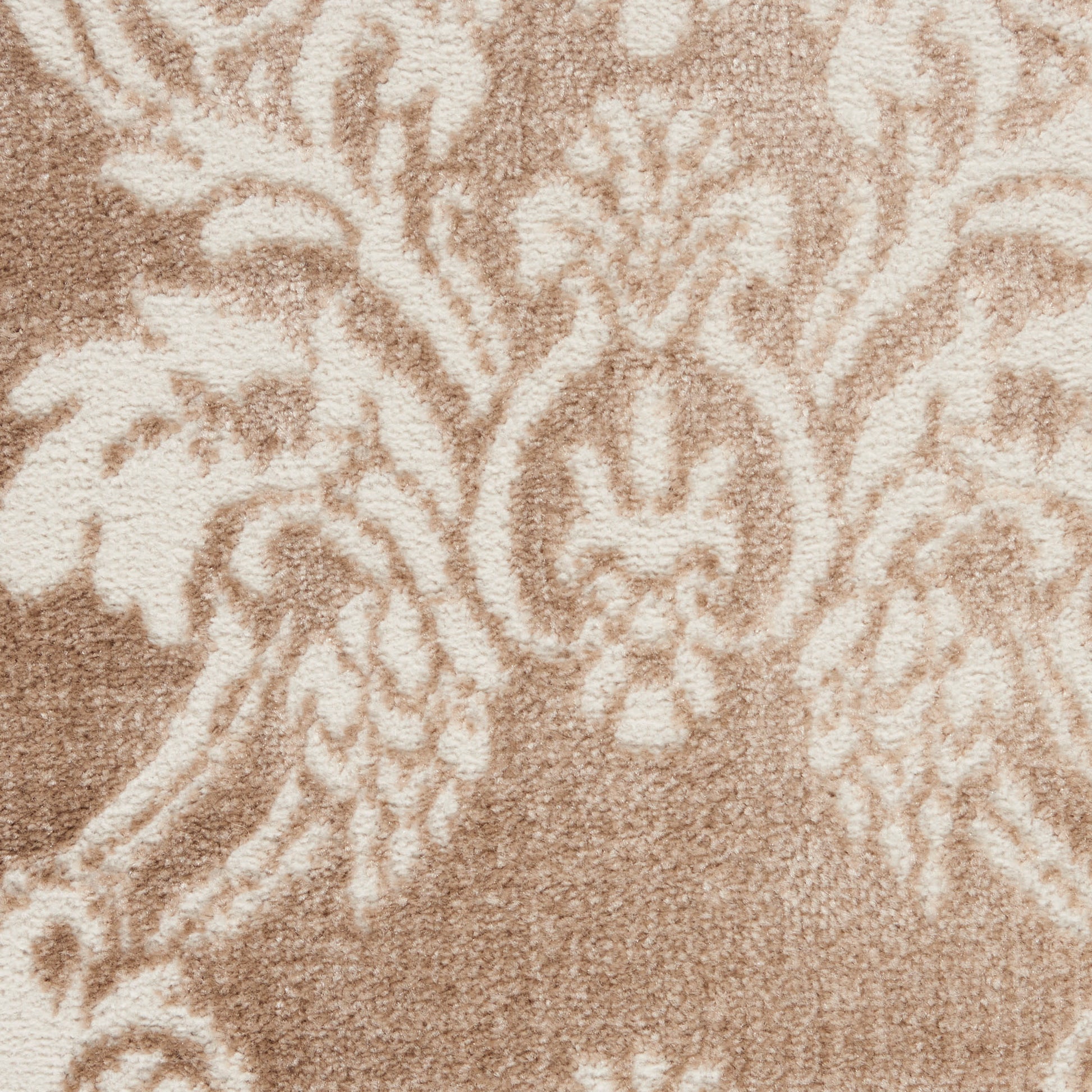 Beige damask upholstery fabric with ornate floral/arabesque motif on taupe-brown background.