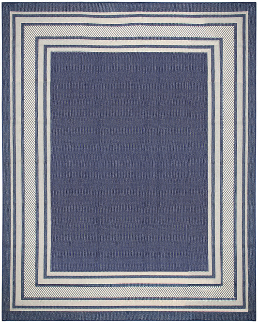 Navy blue rug with a solid center and cream-beige rectangular borders forming a geometric frame.