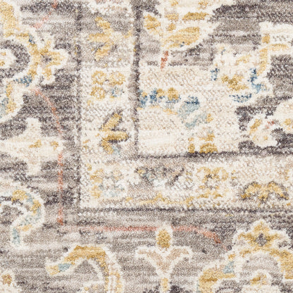 Gray and ivory ornate rug with yellow and blue floral accents and decorative border.