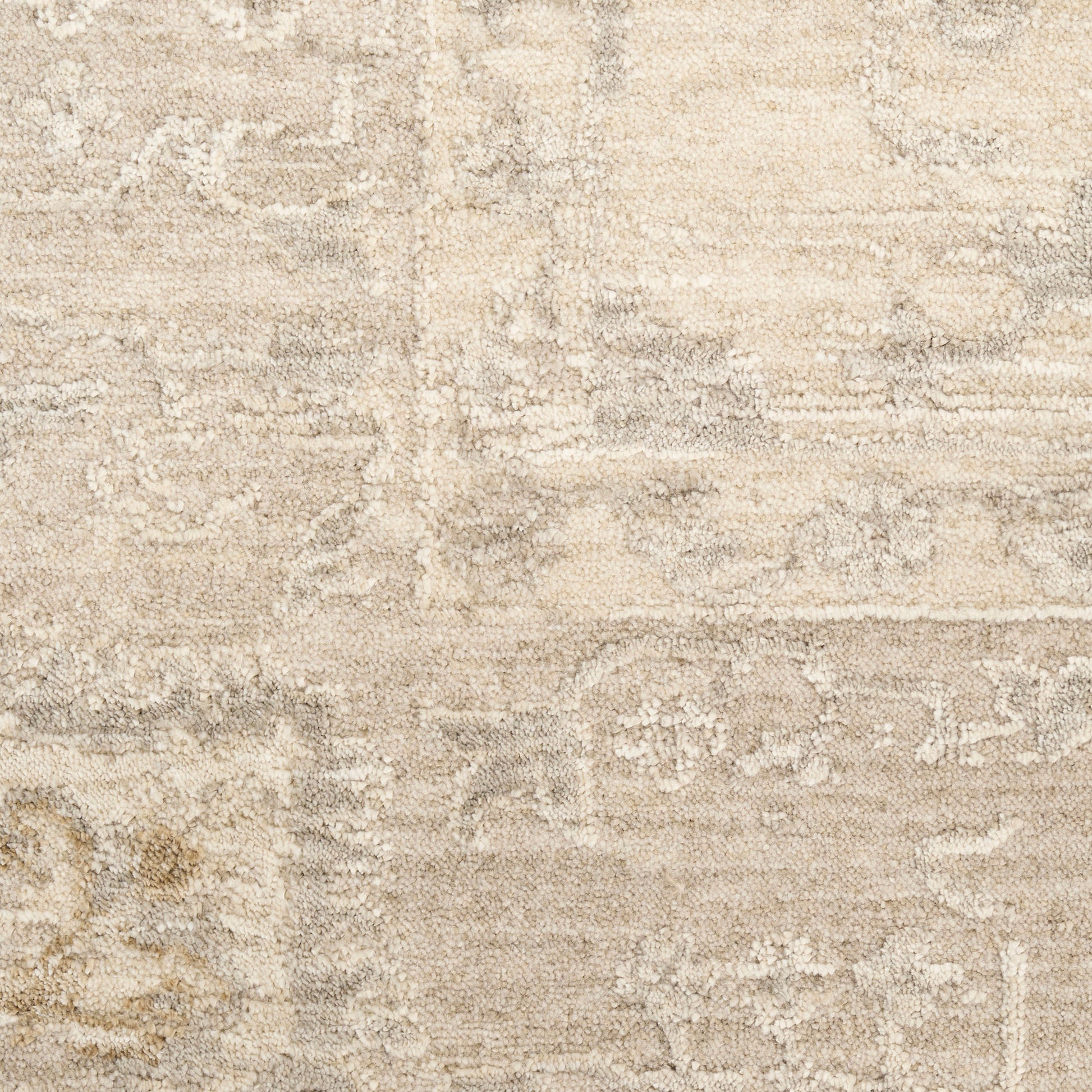 Beige oriental rug with subtle cream & taupe floral medallion pattern; plush, textured pile.