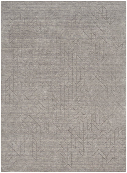 Light gray area rug with a subtle geometric line pattern, modern flat-weave style for living room or bedroom.