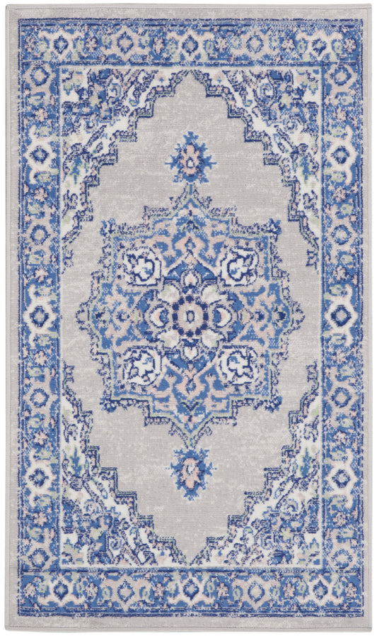 Blue and gray oriental rug with ornate central medallion, floral motifs, and decorative border.