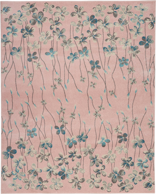 Rectangular pink rug with blue and white floral vines, soft textile decor for a living room.