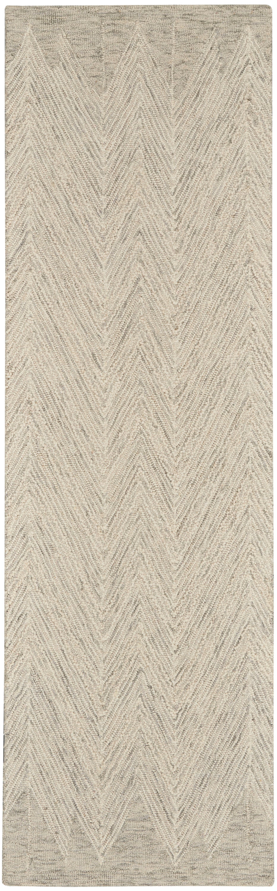 Beige looped-pile rug with cream chevron zigzag pattern, rectangular.
