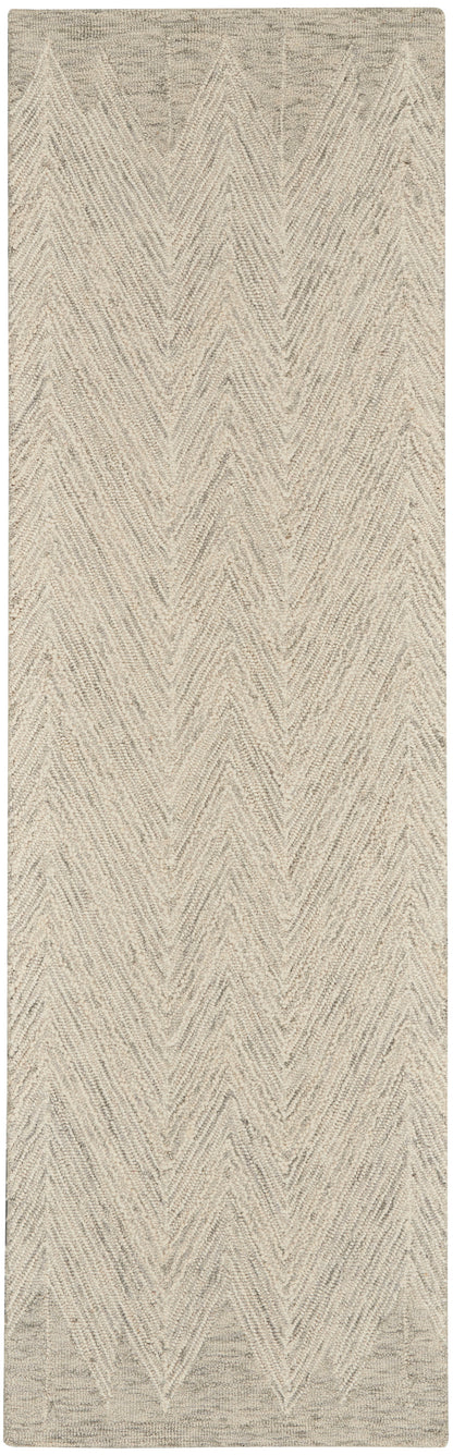 Beige looped-pile rug with cream chevron zigzag pattern, rectangular.
