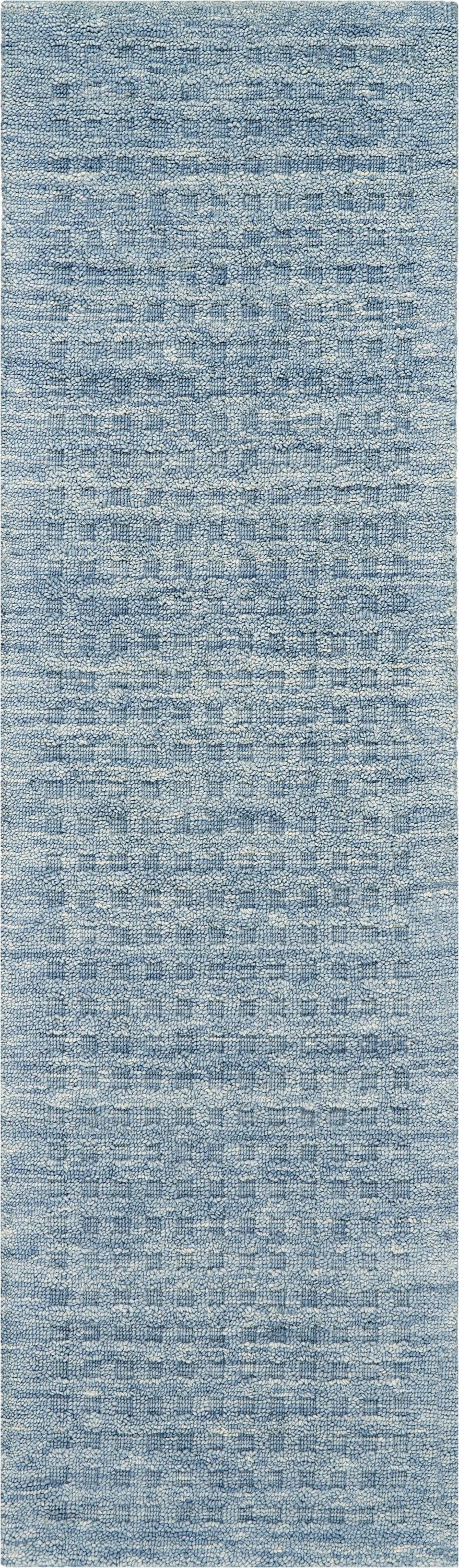 Blue textured rug with speckled loop-pile pattern in light and medium blue tones.