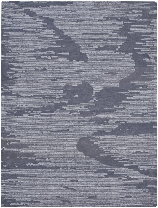Blue and light gray abstract-pattern area rug with cloud-like shapes; woven texture for modern living spaces.