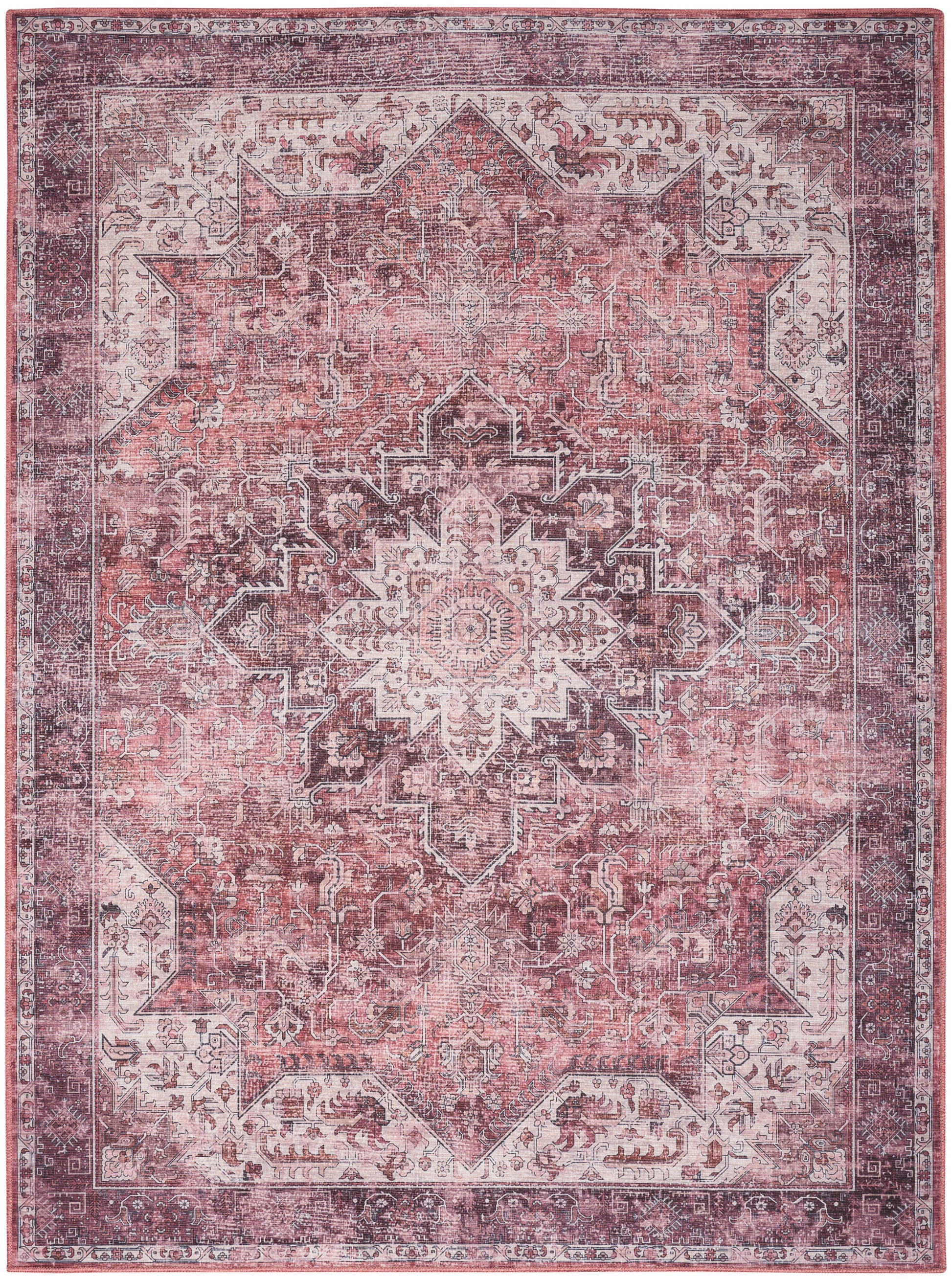 Pink vintage distressed Persian-style rug with central medallion, ornate border & floral motifs.