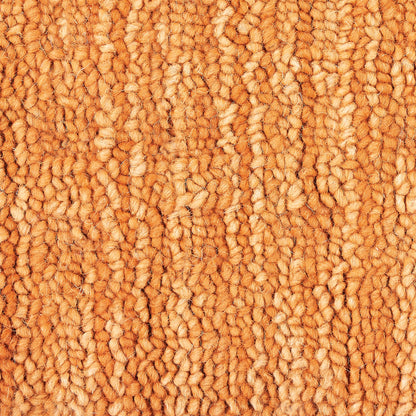 Orange loop-pile carpet close-up with thick, textured fibers for a cozy home rug.