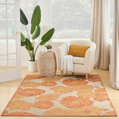 Orange floral tropical area rug.