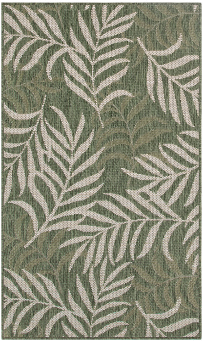 Olive-green woven rug with white tropical palm leaf pattern.