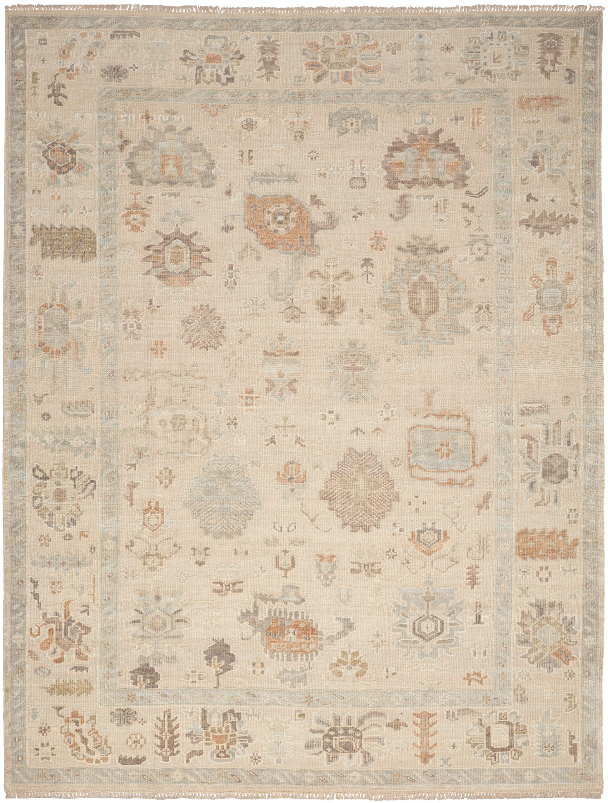 Cream-tan oriental rug with pale blue border, muted floral medallions; vintage distressed look, rectangular area rug.