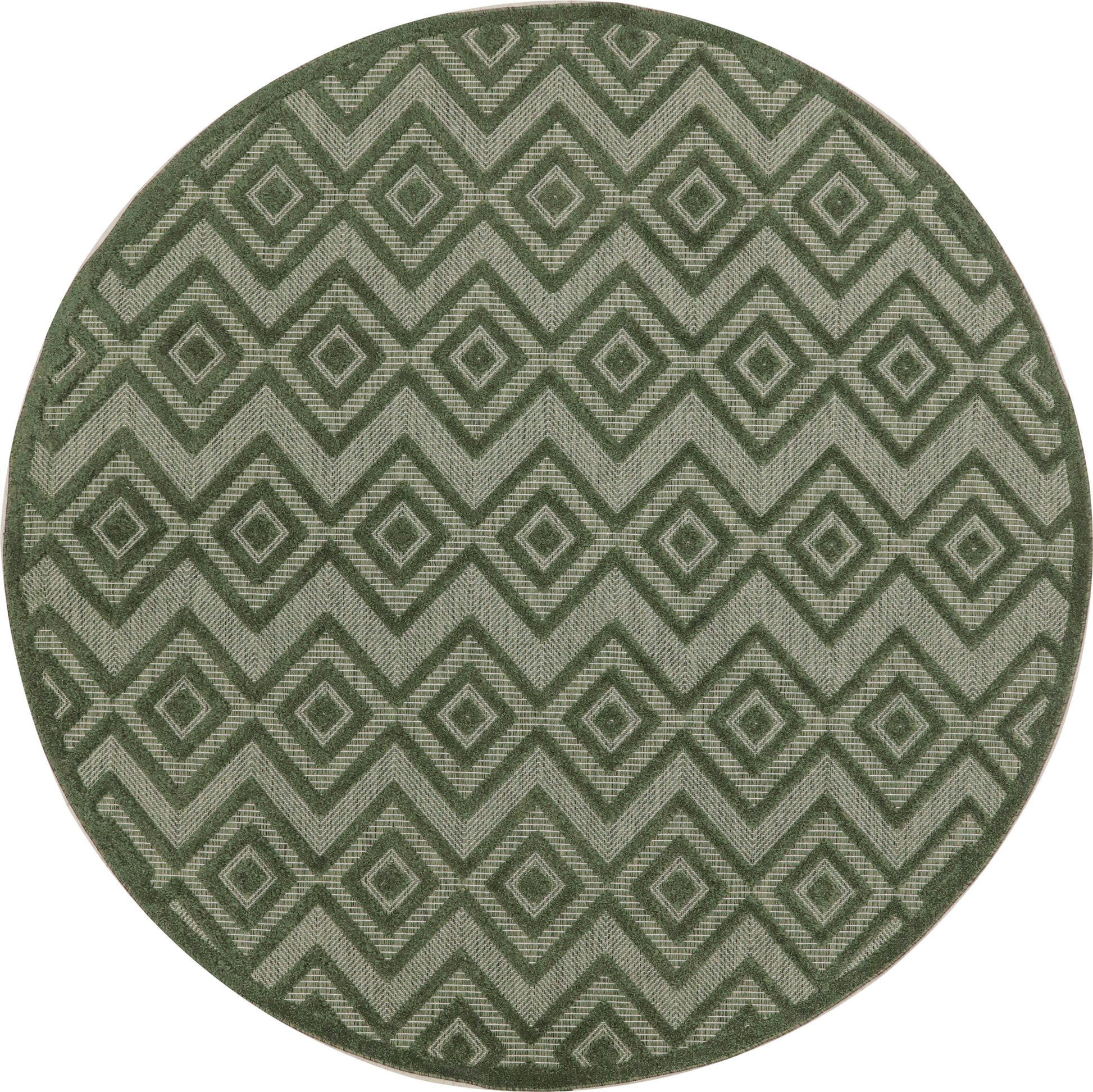 Round green rug with interlocking diamond geometric pattern in light and dark greens.