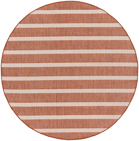 Round terracotta woven rug with white horizontal stripes; warm, textured jute look.