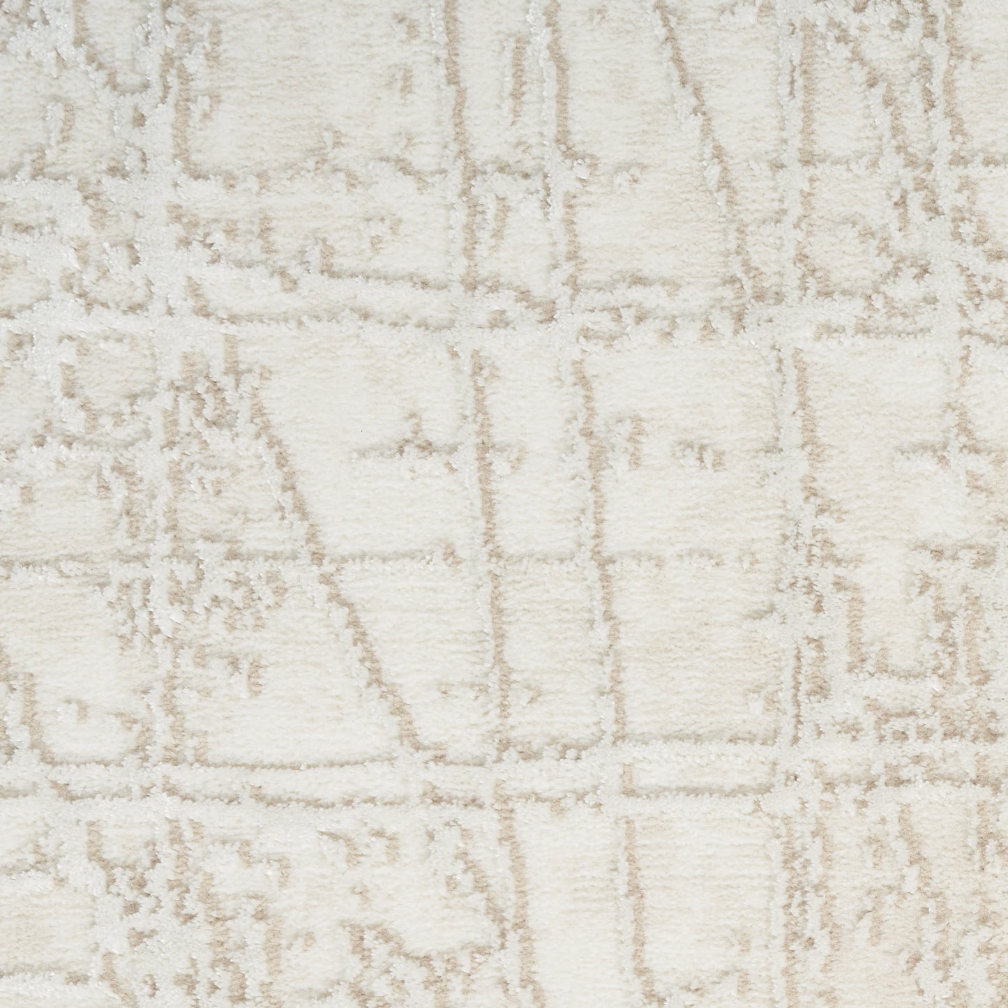 Soft cream rectangular rug with a subtle beige grid pattern and lightly textured pile, ideal for modern neutral decor.