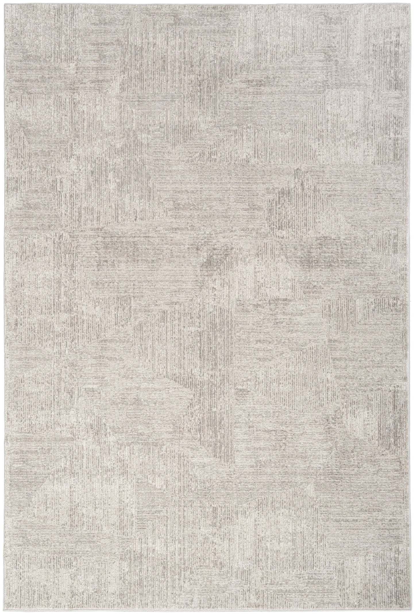 Neutral beige area rug with a subtle geometric patchwork pattern in taupe-gray tones.