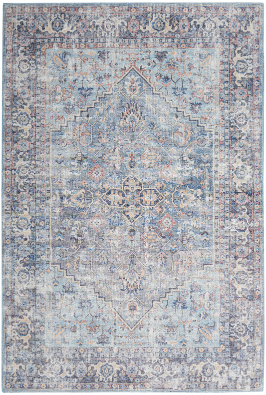 Muted blue distressed Persian-style area rug with central diamond medallion and ornate floral border.