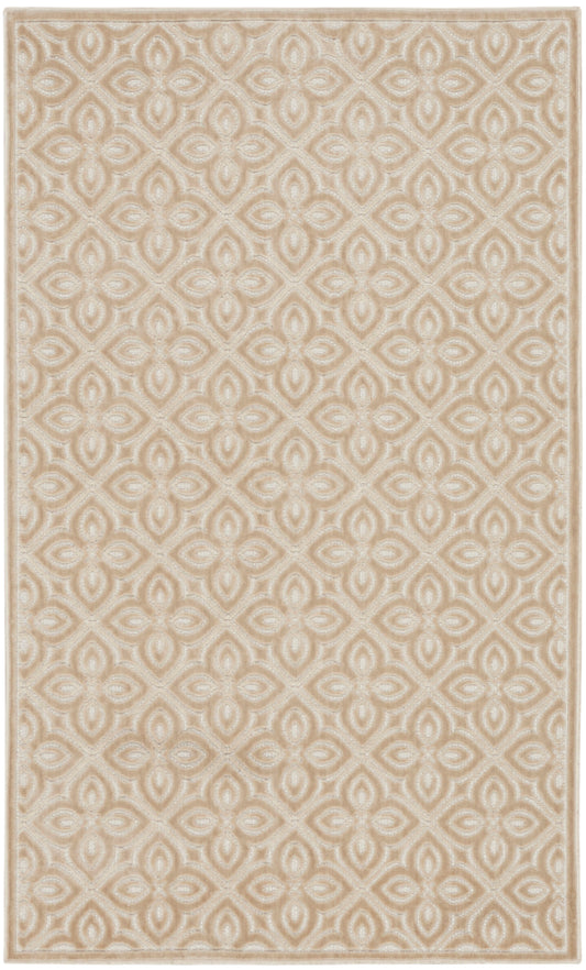 Beige and ivory rectangular rug with an interlocking diamond and quatrefoil pattern; woven texture, neutral decor.