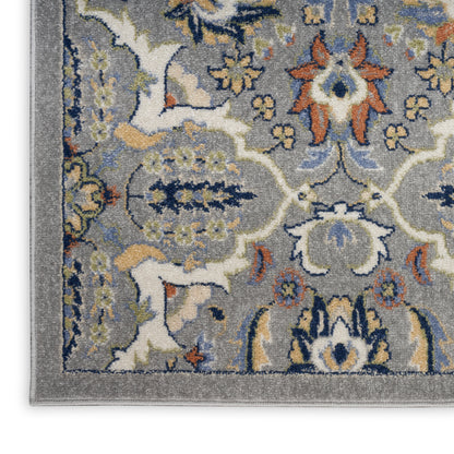 Grey oriental-style area rug with ivory, blue, yellow and orange floral motifs and a bordered edge.