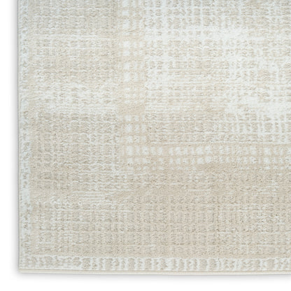 Beige cream geometric area rug with a distressed grid pattern and soft plush pile.