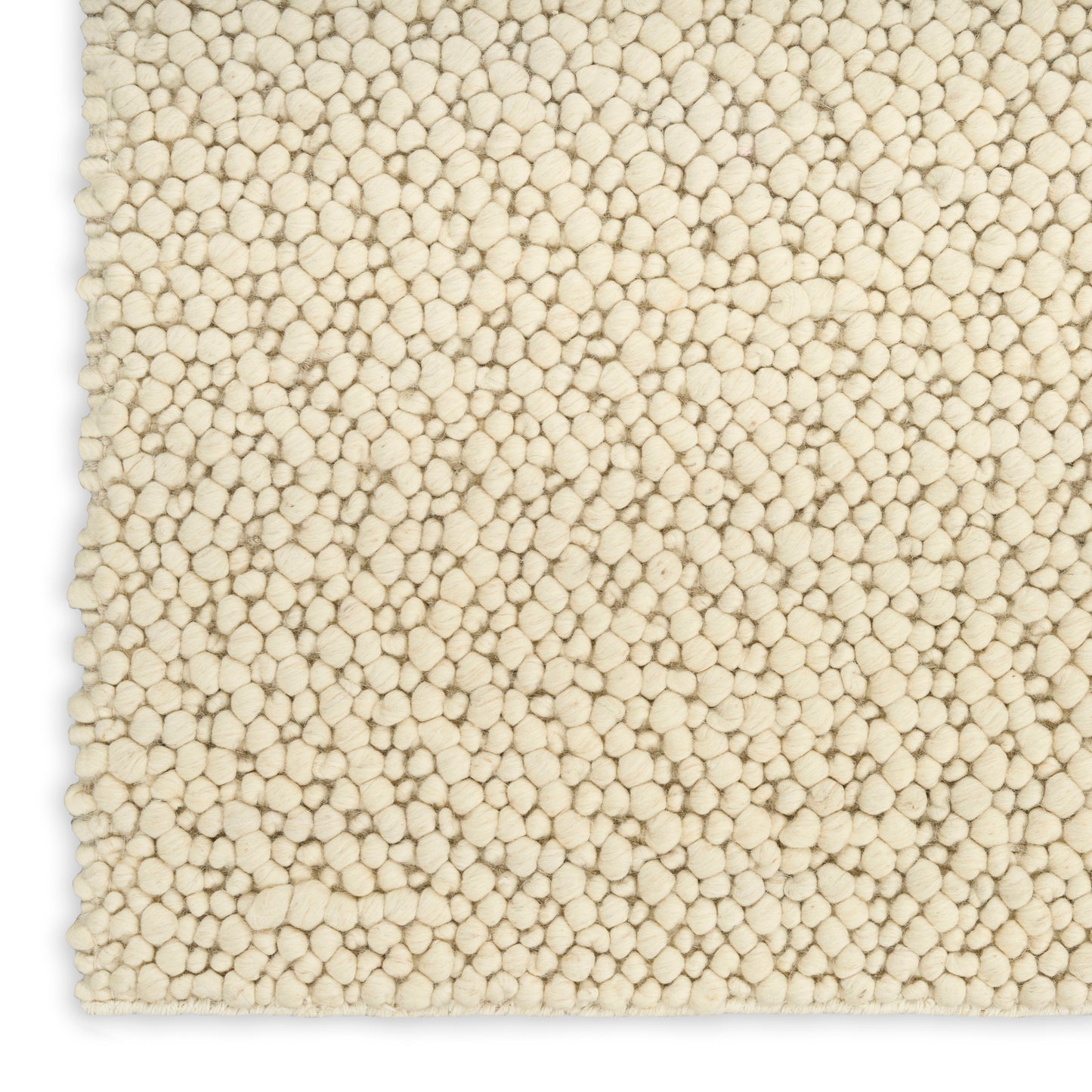 Cream boucle textured rug close-up with dense rounded tuft loops, plush cozy look.