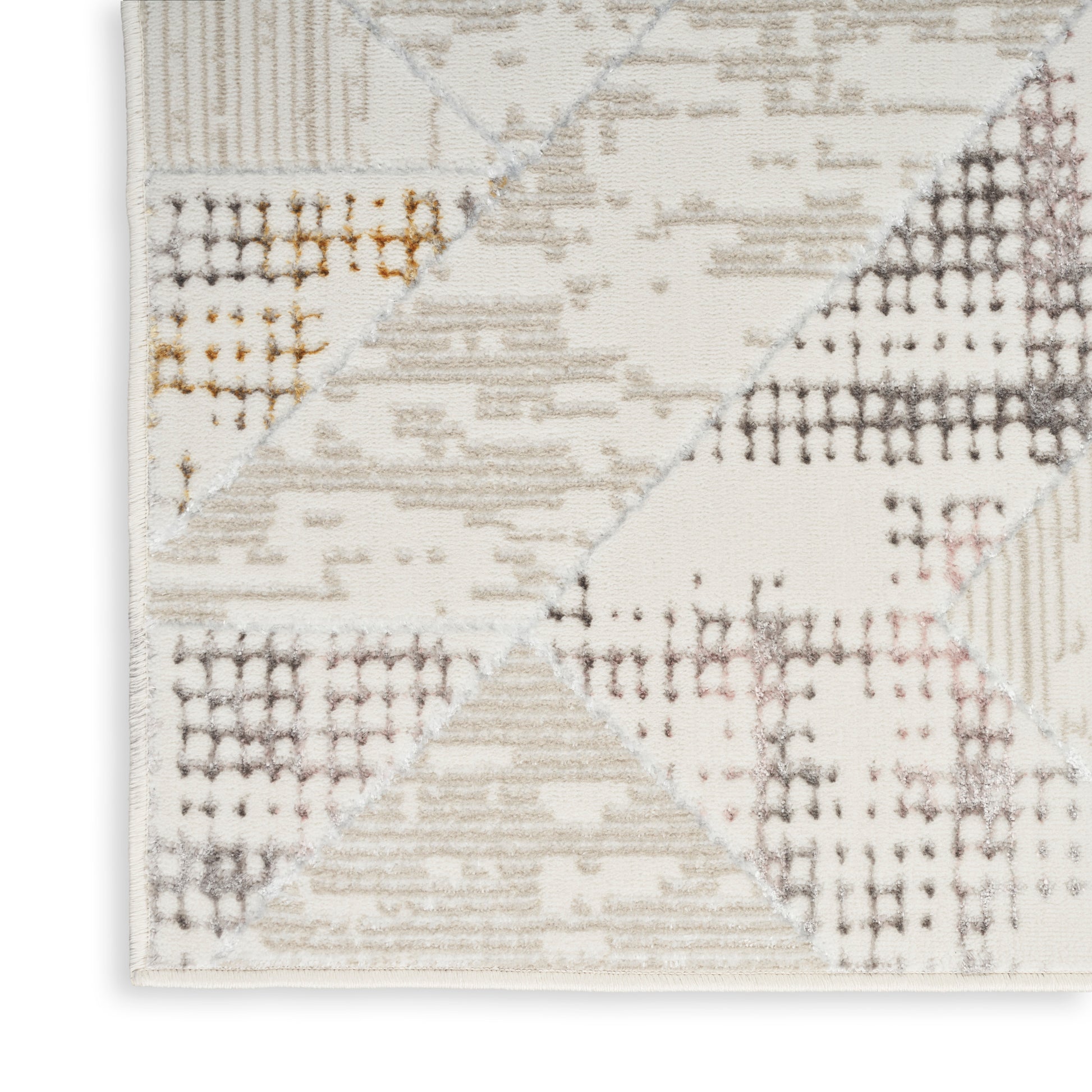 Modern geometric patchwork area rug in cream, beige and taupe with diagonal triangle blocks and a soft woven texture.