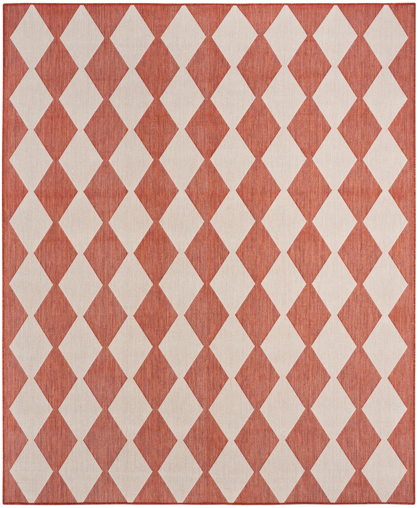 Rust-red rug with cream diamond harlequin pattern, woven texture; rectangular geometric area rug.