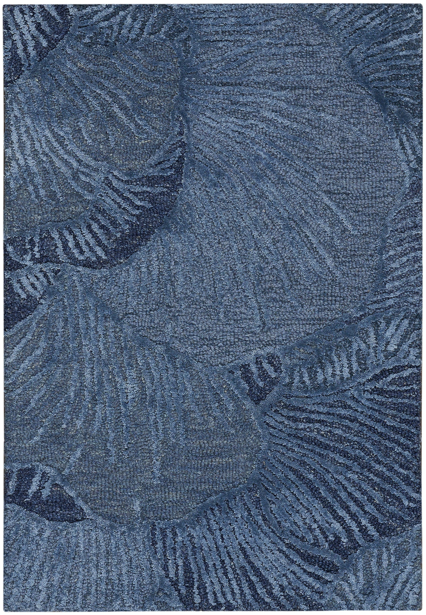 Blue area rug with palm leaf pattern in navy tones; soft, textured pile for living room decor.