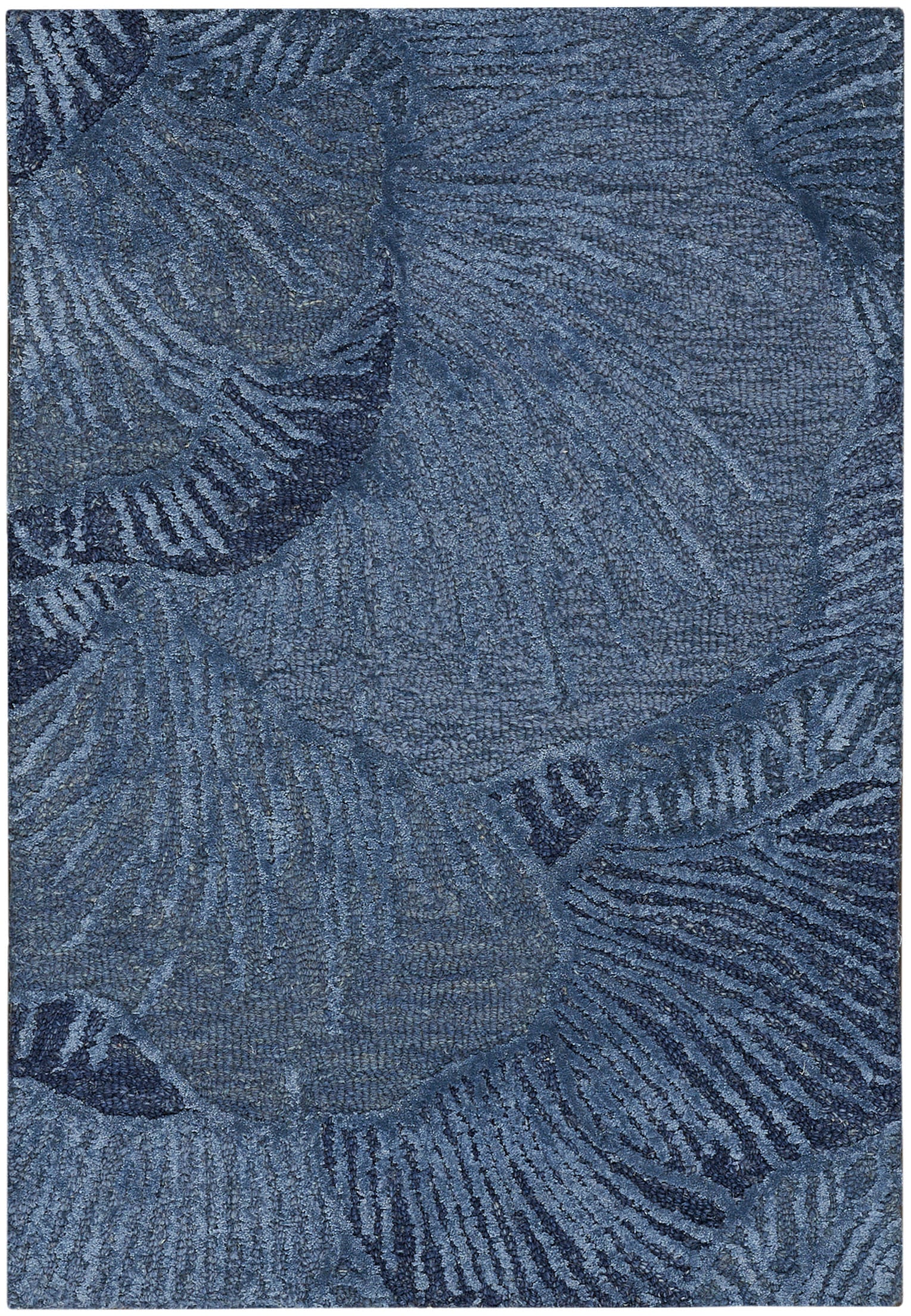 Blue area rug with palm leaf pattern in navy tones; soft, textured pile for living room decor.