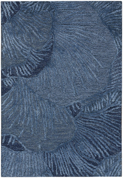 Blue area rug with palm leaf pattern in navy tones; soft, textured pile for living room decor.