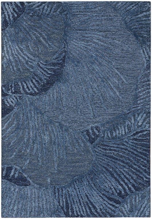 Blue area rug with palm leaf pattern in navy tones; soft, textured pile for living room decor.