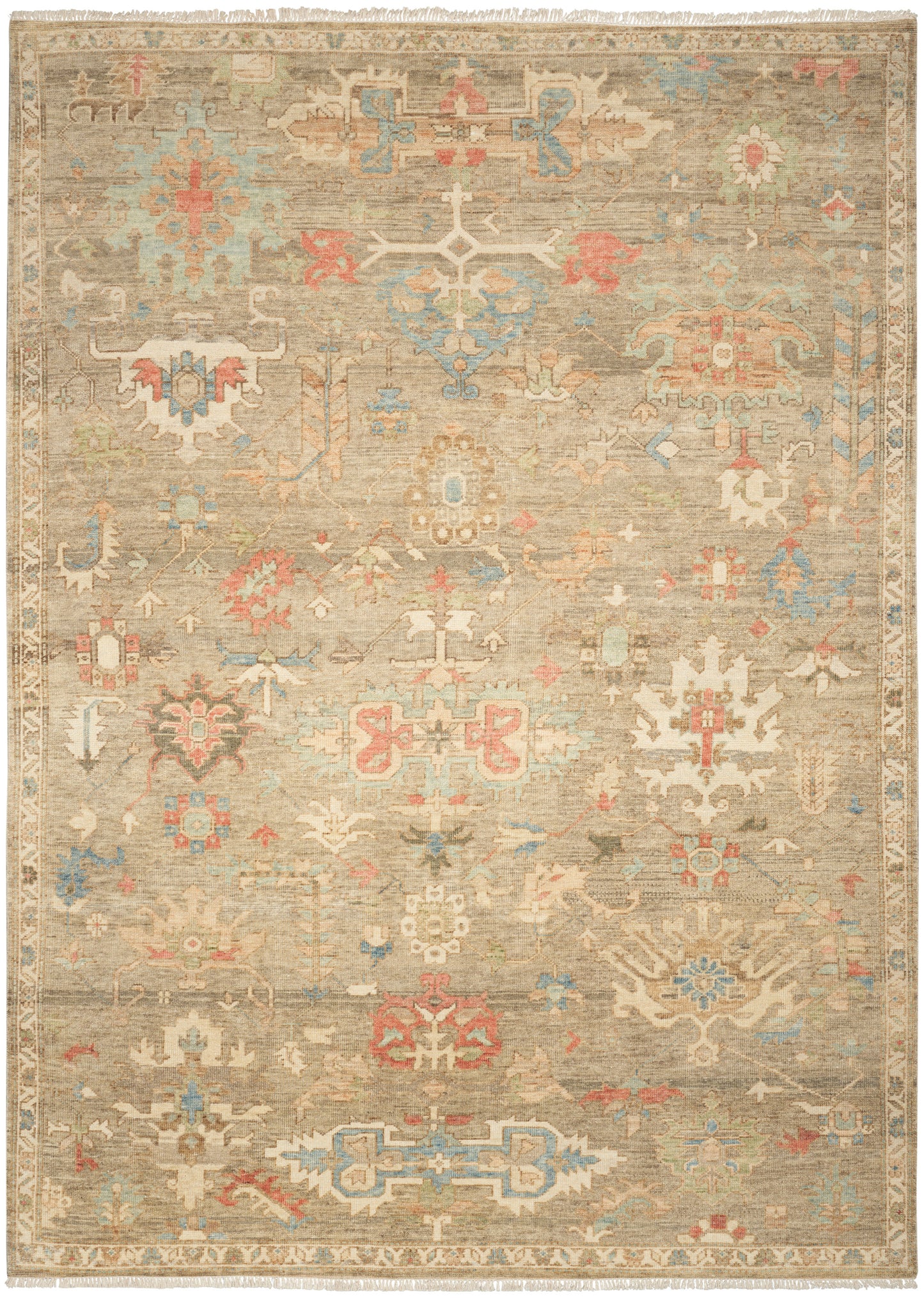 Beige distressed oriental rug with pastel blue, pink and gold geometric medallions; fringed edges.