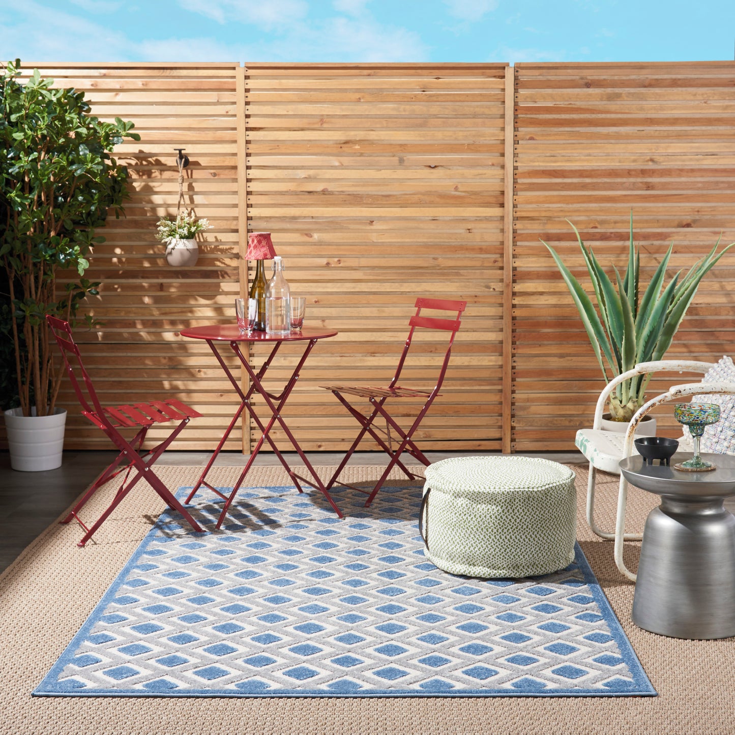 Blue geometric outdoor rug for patio, 4' x 6'.