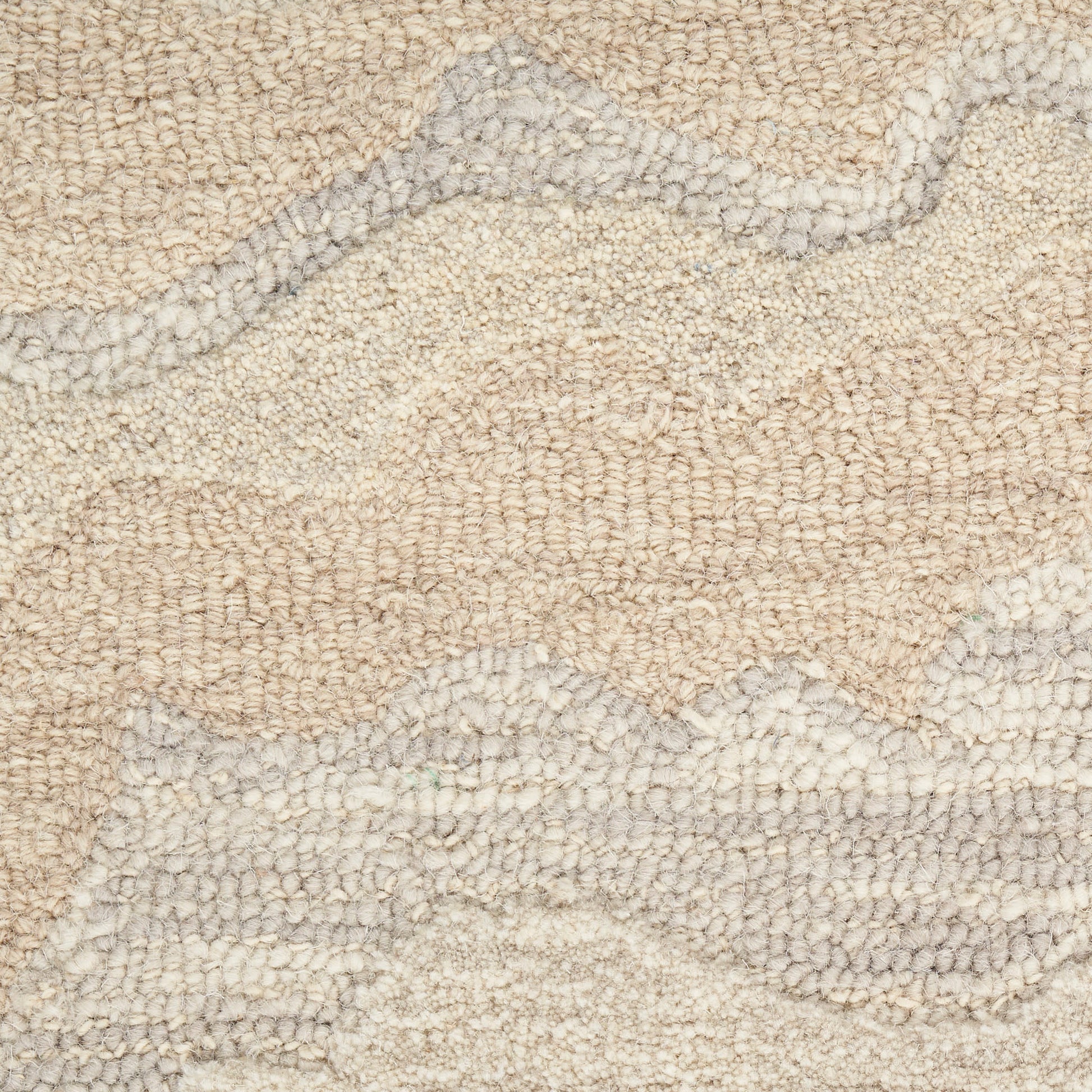Beige textured rug with cream and gray abstract wavy pattern, soft looped pile.