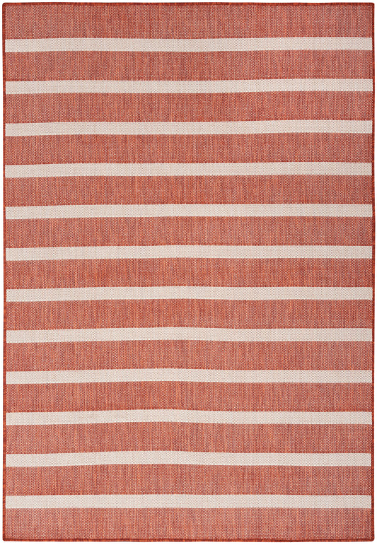 Terracotta woven rug with evenly spaced white stripes; rectangular, cozy contemporary style.