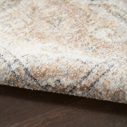 Cream beige textured rug with soft pile and subtle blue-gray pattern on dark wood floor.