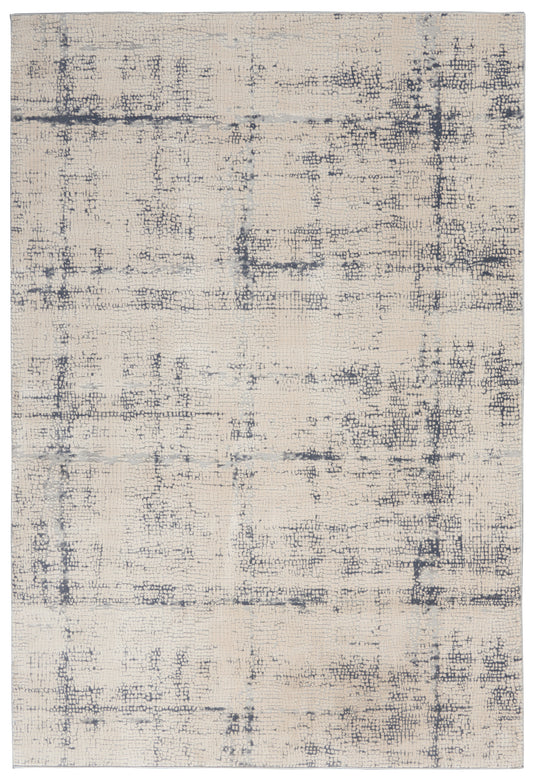 Neutral beige area rug with a distressed charcoal-gray grid pattern and woven texture.