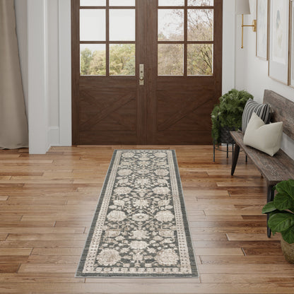 Dark brown wood double doors with glass panes; cream-gray floral runner rug on hardwood entry floor, bench and plants.