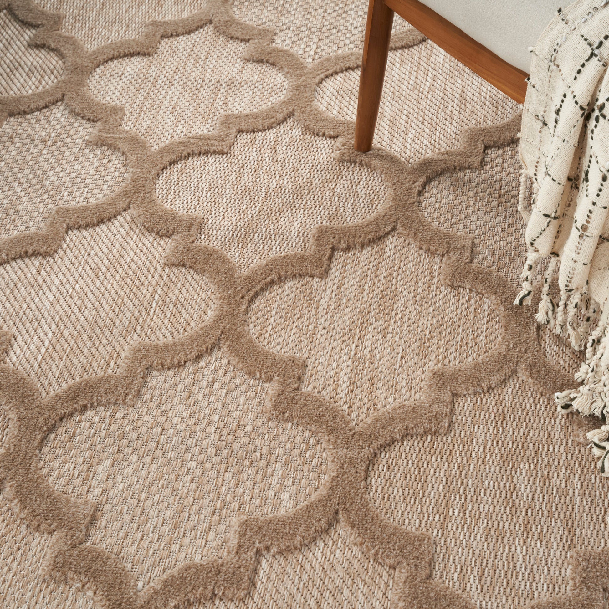 Natural beige jute rug with Moroccan trellis lattice; textured woven surface.