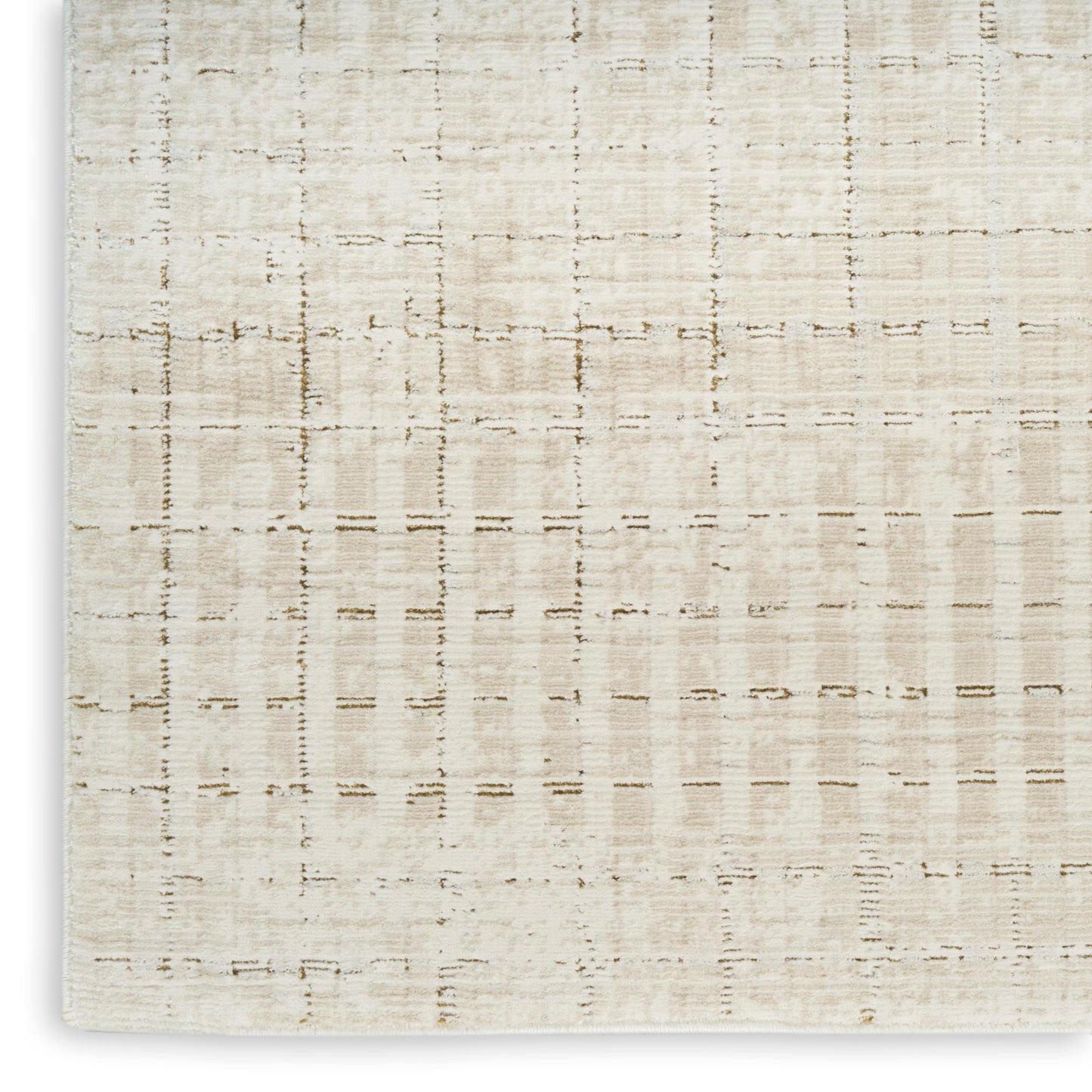 Cream woven rug close-up with a subtle grid pattern; linen-like neutral texture.